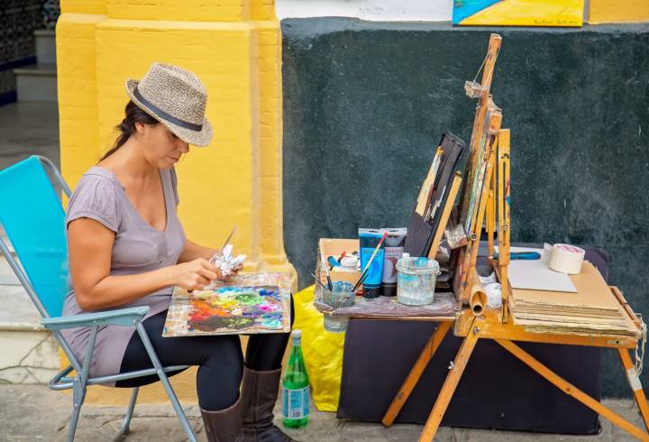 Seville, Andalusia, Spain – October16, 2019: Street artist working in historic Jewish Quarter near Plaza De Espania in Seville